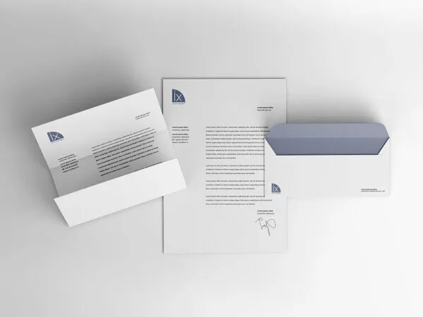 Overhead View of Opened and Folded Letterheads and Envelope Mockup 1