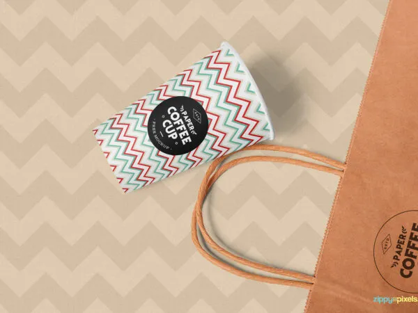 Overhead View of Paper Coffee Cup and Shopping Bag Mockup 1