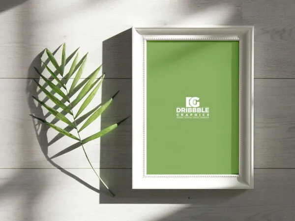Overhead View of Photo Frame Next to a Branch Mockup 1