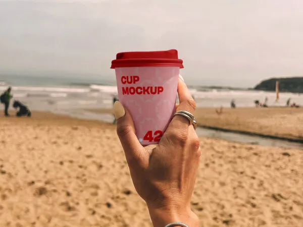 Paper Coffee Cup on the Beach Mockup 1