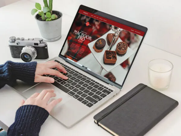 Person Using MacBook Pro Workspace Mockup 1