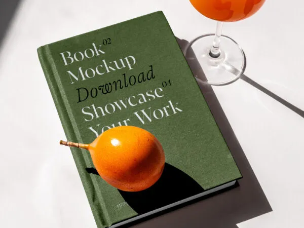 Perspective Sight of Book Cover Mockup with Glass of Juice 1