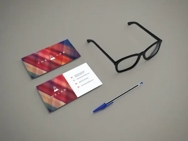 Perspective View Mockup of Two Business Cards with Glasses and Pen 1