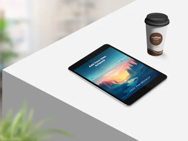 Perspective View Tablet on Table with Coffee Cup Mockup 1