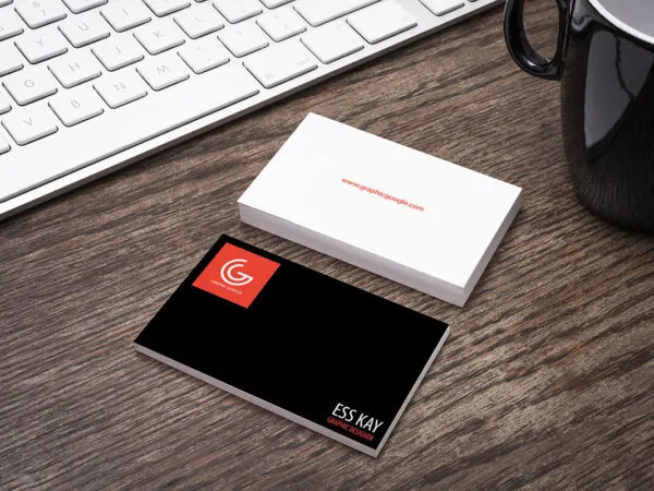 Perspective View of Business Card on Wooden Desk Mockup 1