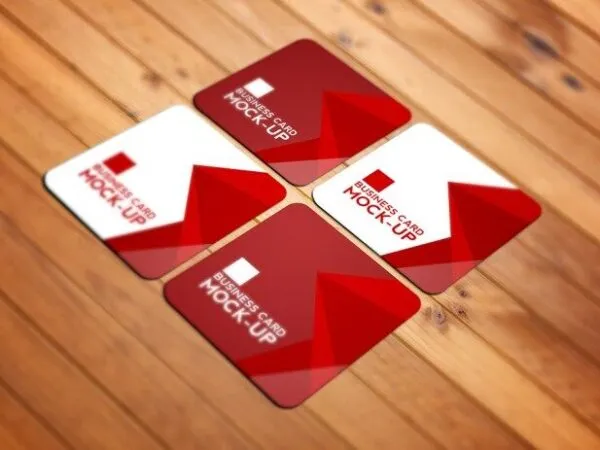 Perspective View of Four Square Business Cards on Wooden Texture Mockup 1