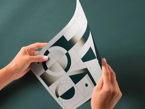 Perspective View of Glossy Paper Mockup in Hands 1
