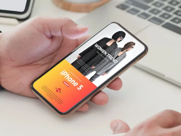 Perspective View of Hand Holding iPhone Five Mockup 1