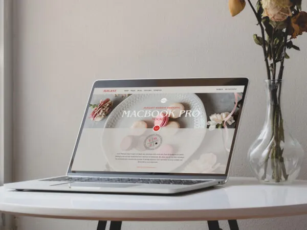 Perspective View of MacBook Pro on Circular Table Mockup 1