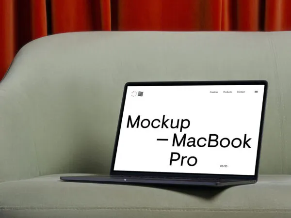 Perspective View of Modern MacBook Pro Mockup on Sofa 1