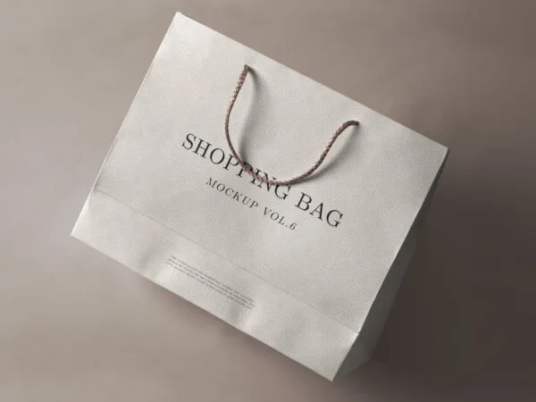 Perspective View of Shopping Bag Laid on the Ground Mockup 1