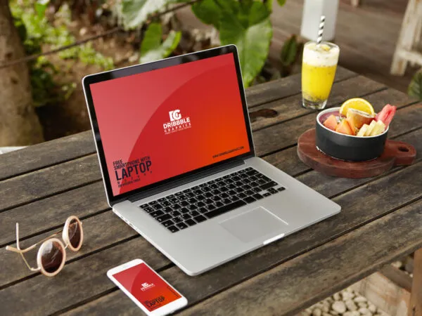 Perspective View of Smartphone and Laptop on Wooden Table Mockup 1
