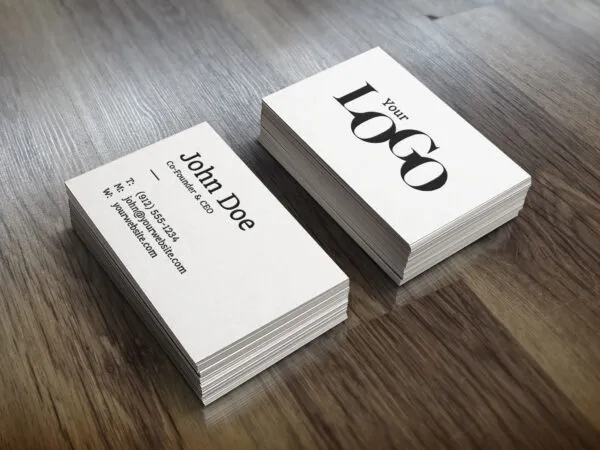 Perspective View of Two Packs of Business Card on Wooden Surface Mockup 1