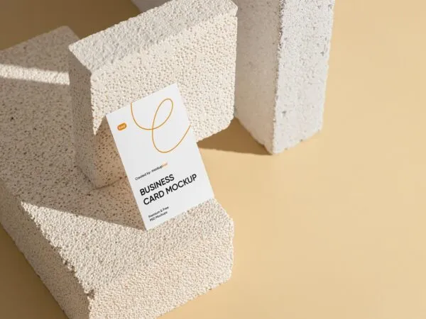 Perspective View of Vertical Business Card Mockup on Brick 1