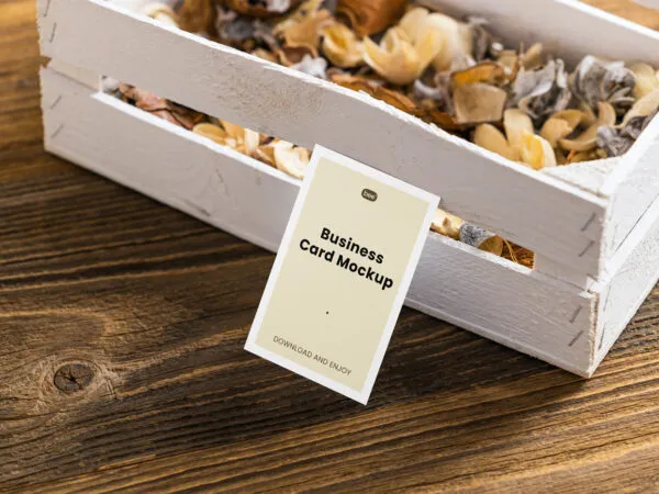 Perspective View of a Business Card Mockup Leaning on a Wooden Box 1