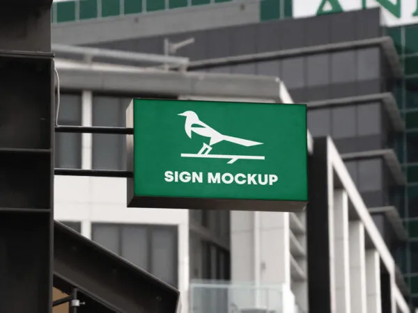 Perspective View of a Wall Mounted Shop Sign Mockup 1