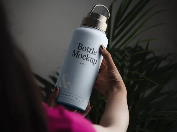 Perspective Vision of Woman Holding Bottle Mockup 1