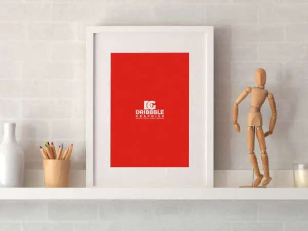 Photo Frame on a Shelf with Pencil and Statue Around Mockup 1