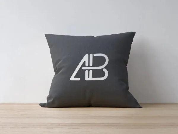 Pillow Placed on Wooden Texture and Leaned on a Wall Mockup 1