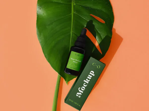 Plastic Essential Oil on a Leaf Mockup Top View 1
