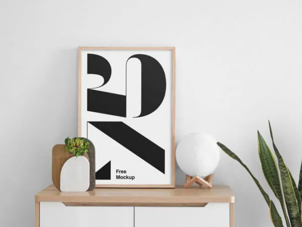 Poster Mockup on a Cabinet Next to a Plant 1