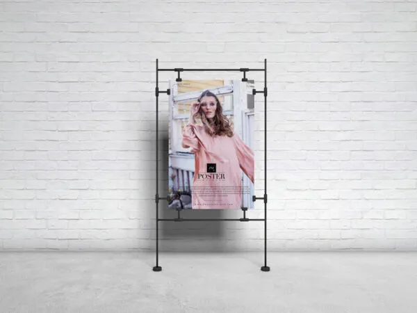 Poster on Sandwiched Clasps in Front of Brick Wall Mockup 1