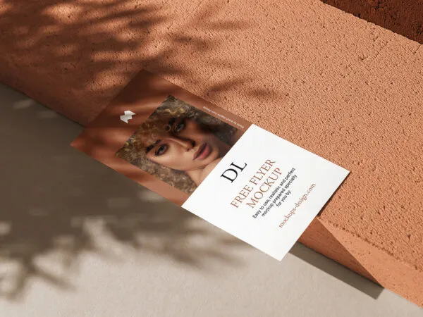 Realistic Dl Flyer Lying on a Concrete Stone Mockup 1