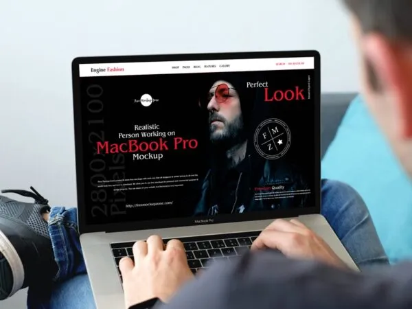 Realistic MacBook Pro Mockup Featuring Man Working 1