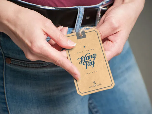 Realistic Mockup Featuring a Woman Holding a Hang Tag 1