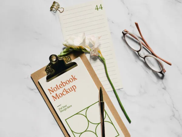Realistic Notebook Mockup with Flower and glasses 1