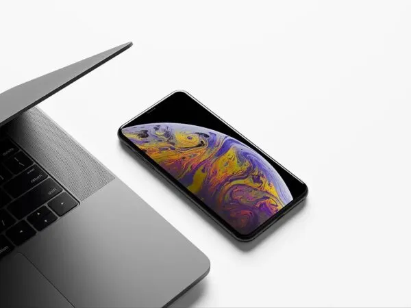 Realistic iPhone XS Max Mockup next to a MacBook 1