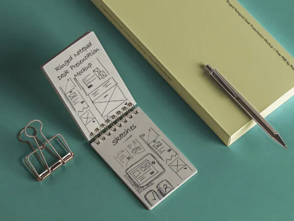 Ringed Notepad Desk with a Binder Clip Mockup 1