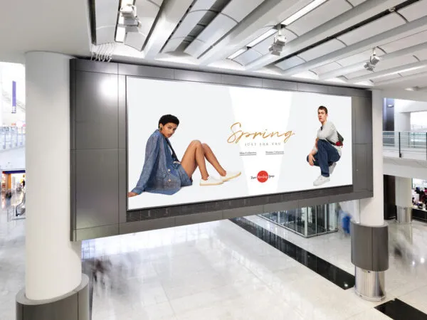 Side View of Horizontal Modern Shopping Mall Digital Advertisement Mockup 1