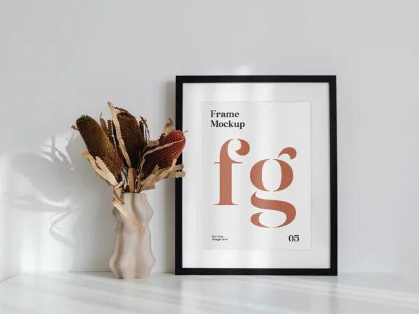 Simple Frame on the Desk Mockup Next to a Flower 1
