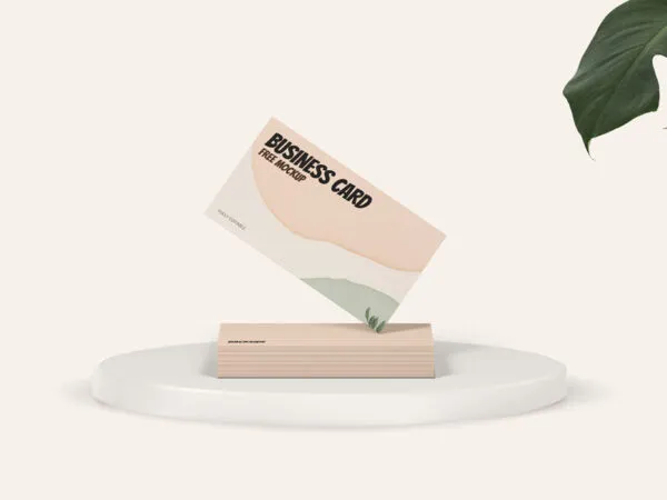 Slanting Business Card on a Stack of Cards in the Front View Mockup 1