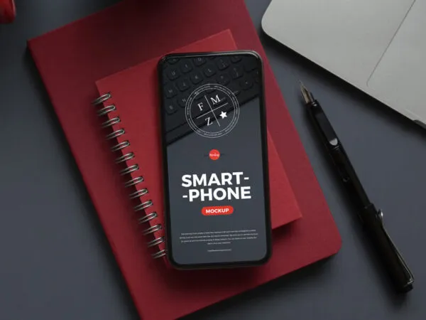 Smartphone Mockup Laid on Notebook in Top View 1