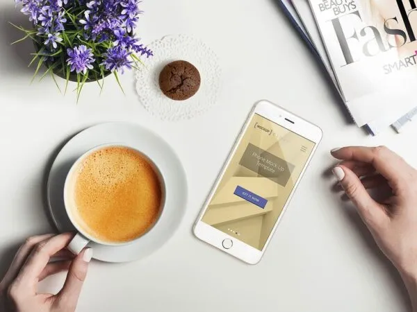 Smartphone Top View in a Hand Holding Cup Setting Mockup 1