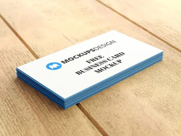 Stack of Professional Business Cards on a Wooden Surface Mockup 1