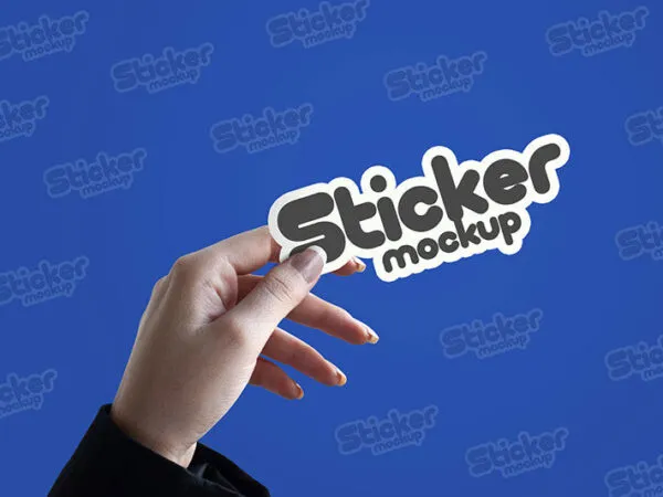 Sticker Mockup Featuring a Female Hand Holding it in Front View 1