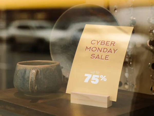 Tabletop Sign Holder Mockup with Cup at Store Display Window 1