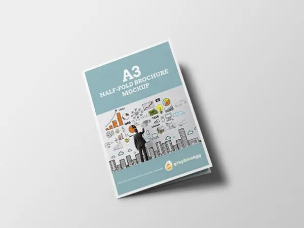Three Mockups Showing Overhead Views of Half Fold A3 Brochure 1