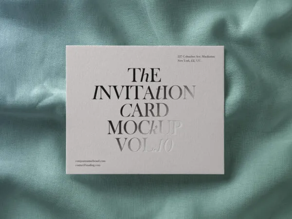 Top View Invitation Card Laying Down on Fabric Mockup 1