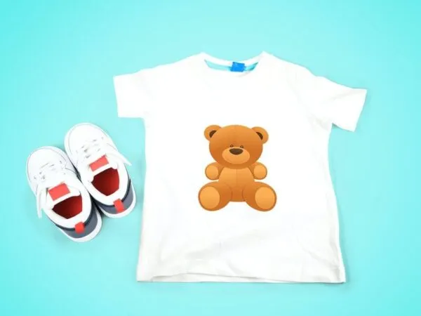 Top View Kids T shirt Mockup Next to Kids Sneakers 1