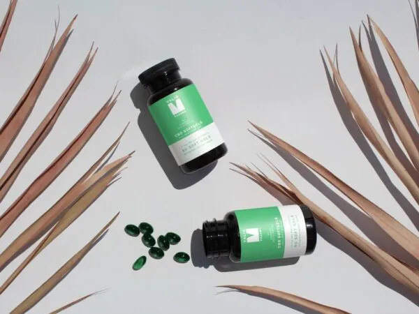 Top View Mockup of Two Soft Capsule Bottles on Floor 1