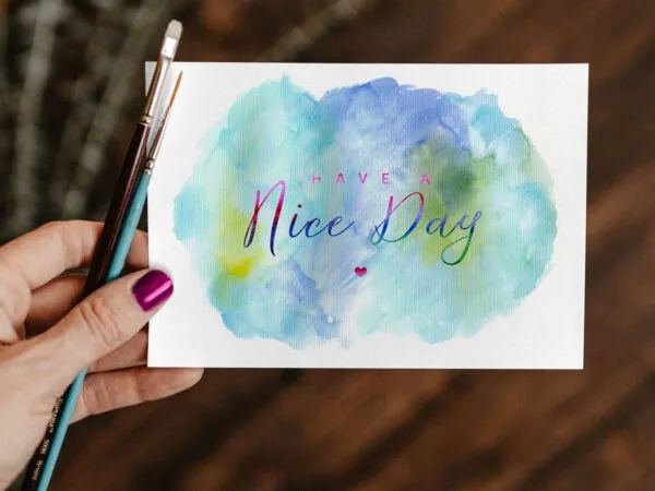 Top View of A Greeting Card Mockup In A Womans Hand 1