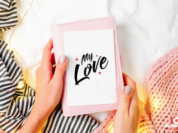 Top View of Girl Holding a Greeting Card Mockup 1