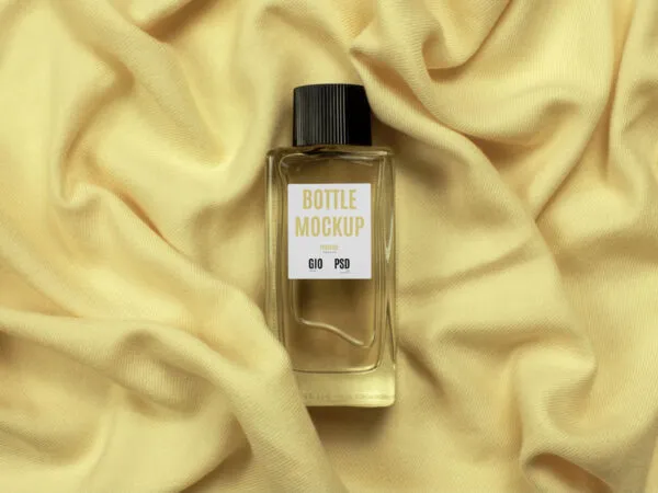 Top View of Glass Bottle Perfume Mockup on Fabric 1