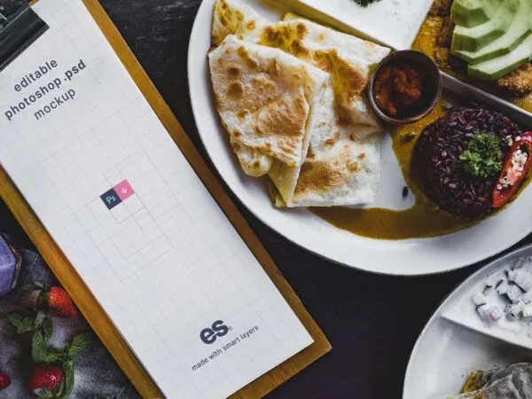 Top View of Tall Restaurant Menu Mockup on Dining Table 1