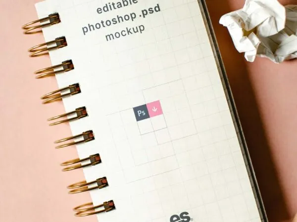 Top View of Vertical Spiral Notebook Mockup with Scrambled Papers 1