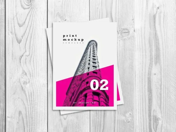 Top View of a FlyerPoster on a Wooden Table Mockup 1
